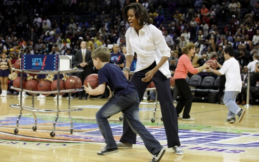 First Lady Michelle Obama and relay participant at the Let's Move! CIAA pre-game