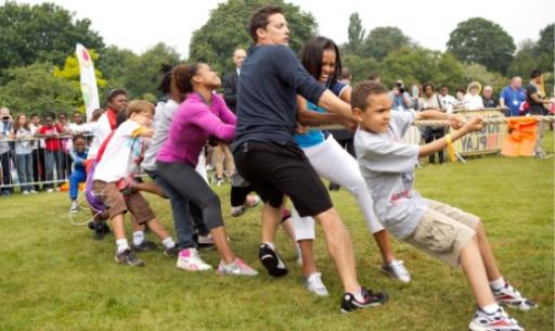 First Lady Michelle Obama plays tug o war at Let's Move! London