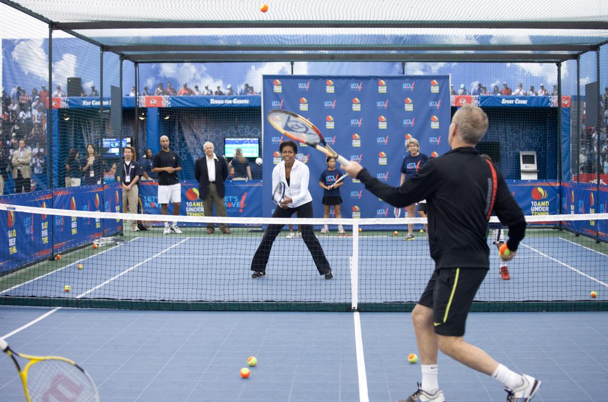 First Lady Michelle Obama hits balls with John McEnroe in a Let's Move! event 