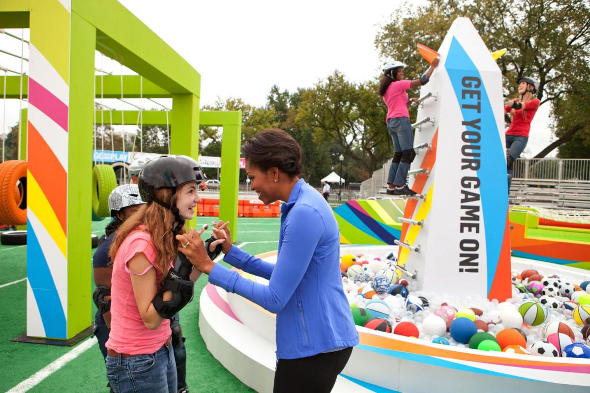 First Lady Michelle Obama congratulates kids on the Obstacle Course at Nickelodeon’s Worldwide Day of Play 