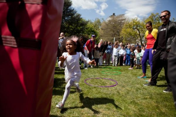 First Lady Michelle Obama Visits The Obstacle Course