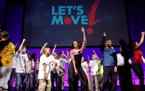 First Lady Michelle Obama dances with students in Des Moines, IA
