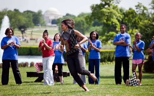 First Lady Michelle Obama participates in the “Pit Crew Challenge."