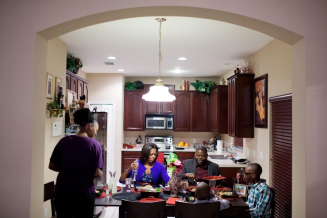 First Lady Michelle Obama eating dinner