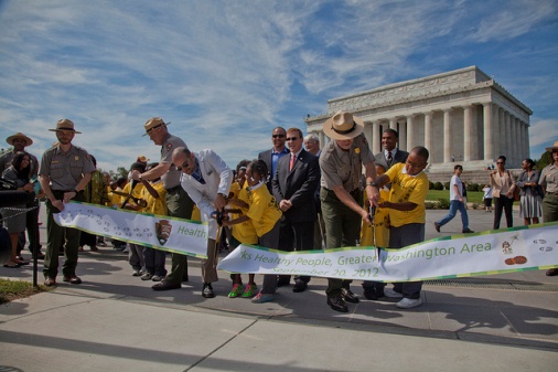 Third graders from Neval Thomas Elementary School help cut the ribbon for the DC Area first TRACK Trail on the National Mall.