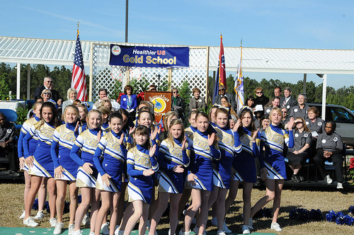 Sixth Grade cheerleaders from Sumrall Middle School perform a “healthy eating” cheer during a HealthierUS School Challenge awards ceremony where their school received a Gold level award from USDA FNCS Deputy Under Secretary Dr. Janey Thornton.  