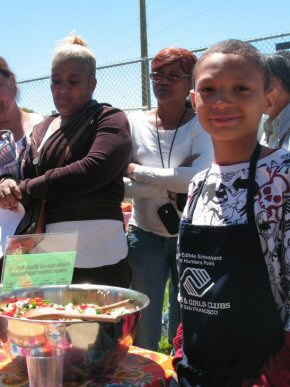 Nick offers the salad he prepared from the garden to his clubmates