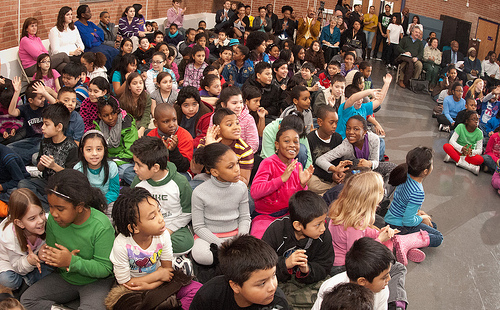 The students and faculty applaud as Agriculture Under Secretary for Food, Nutrition and Consumer Services Kevin W. Concannon  stepped up to the podium to present the Gold Award of Distinction to the Elsie Whitlow Stokes Community Freedom Public Charter School, on Wednesday, Feb. 2, 2011.  The school is the first Washington, D.C. to achieve the gold Award of Distinction from the HealthierUS School Challenge (HUSSC).  They will now hold the certification and distinction for four years. The goal of the HUSSC is to improve the health of the Nation’s children by promoting healthier school environments. The challenge criteria include four major elements. (U.S. Department of Agriculture photo by Lance Cheung)