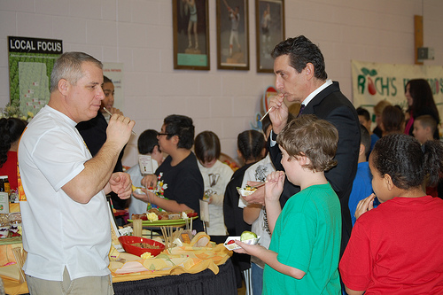 Sampling Organic Honey Straws (left Bee Keeper Jeff Mello; right Regional Administrator James Arena-DeRosa; students from Pawtucket schools) 