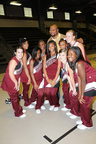 Jenod Deuce McAllister poses with Byram Middle School cheerleaders after their school received the HUSSC Gold Award (photo by Debbie Smoot).